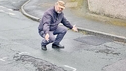 Steve Guy showing pothole 